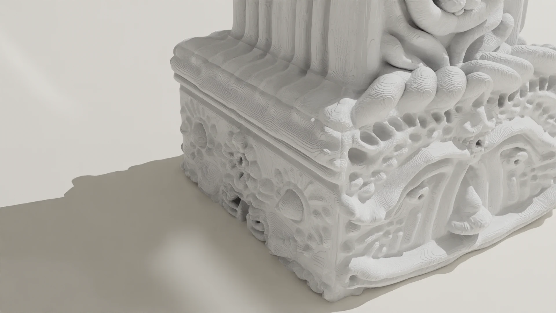 Temple — plinth detail showing dense organic tentacular carved stonework beneath the classical exterior